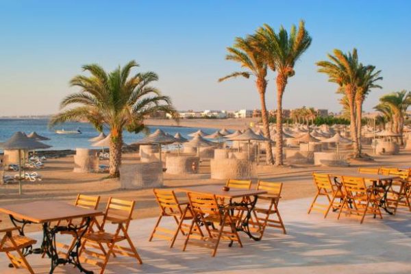 Idylic beach with palms and sun umbrelas, Red Sea, Egypt