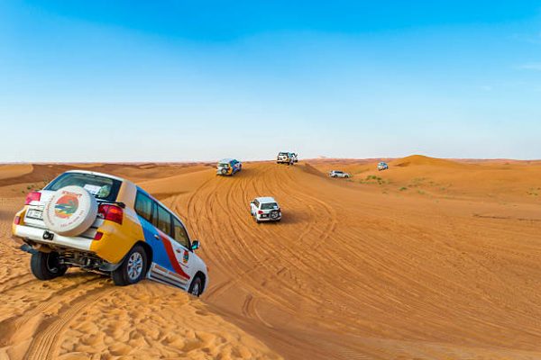 Dubai, United Arab Emirates - 20 April, 2016: Jeeps are departing for a desert safari in the middle of the desert.